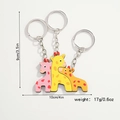 Detailed view of wooden giraffe family puzzle keychain with size and weight dimensions - Giraffe Family of Three