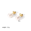 Detail view of 8mm white pearl stud earrings with 18K gold plated titanium steel finish - 8mm / Gold
