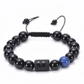 Close-up of Gemini zodiac bracelet with black agate beads and adjustable woven cord - Gemini