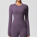 Close-up of seamless purple long sleeve yoga top featuring high-elasticity brushed fabric - Eggplant Purple