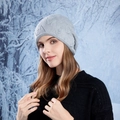 Light gray knitted slouchy beanie with elegant pearl accents in a snowy winter scene - Gray