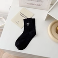 Women's black calf-length socks featuring colorful dots and white heart embroidery - One Size / Black