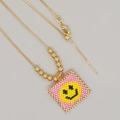 Bohemian gold chain necklace featuring a pink beaded square pendant with yellow smiley face - Yellow Happy Face-Metal Chain