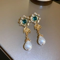 Macro shot of vintage gold flower earrings with green stones and pearl pendants - Flower Teardrop Style (25#)