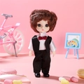 Doll in boy style with brown curly hair, white shirt, black vest and red bowtie - Clear Sky Boy Doll