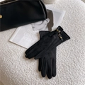 Women's black suede winter gloves with elegant gold chain link and leather buckle detail - Horsebit Chain / Black