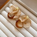 Macro detail of French retro chiffon flower earrings with amber resin and gold metal - French Vintage Floral Jewelry (53#)