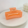 Orange square hollow hair claw clip made of glossy acrylic with a gold spring - Orange