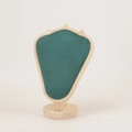 Macro view of green velvet bust stand with wooden frame for luxury jewelry necklace display - Natural Wood Green