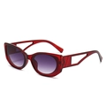 Oval sunglasses with translucent red frames and hollowed-out geometric temples - Red Frame Double Grey Lens