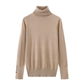 Detailed close-up of beige ribbed knit sweater sleeves with golden button accents - Khaki
