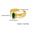 Adjustable golden twisted stainless steel ring with an oval green gemstone - Green