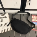 Versatile black canvas crossbody waist bag with adjustable strap and sleek crescent design - Black