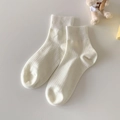 White ribbed knit cotton ankle socks in minimalist Japanese style on grey background - Cream