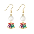 Detail of Christmas bell earrings with red bows, pearls, and colorful enamel charms - Golden Bell with Pearl Dangle