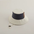 Detail view of retro color-block bucket hat with adjustable drawstring and woven label - 2-5 Years Old / White Color-block