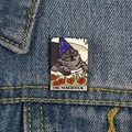 Enamel tarot pin featuring a black cat magician design pinned on blue denim fabric - XC702-The Magician Cat