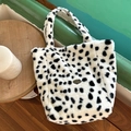 Fuzzy cow print plush tote bag with handmade label in black and white pattern - Black and White Plush Reversible Shoulder Bag