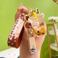 Portachiavi creativo con orsetto bubble tea e sabbie mobili con cinturino in silicone - Set Tazza di Tè al Latte + Tagliaunghie