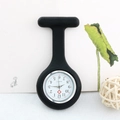 Detail of a black silicone nurse fob watch with a white quartz dial and red cross symbol - Black