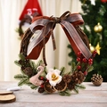 Illuminated Christmas wreath with pink swan and red berries on a rustic vine base - Swan Style