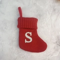Red knitted Christmas stocking with sparkly white letter S and convenient hanging loop - Letter S