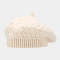 Detailed knit texture of a cream wool beret featuring classic cable stitch patterns - Beige