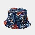 Close-up of tropical palm leaf pattern and vibrant blue prints on a reversible bucket hat - M (56-58cm) / 20# Blue Orange Tropical