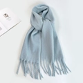 Detail of light blue mohair knit scarf with fringe tassels on a clean white background - Light Blue Zircon