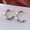 Macro shot of C-shaped earrings with white pearls and marbled stone beads on silk fabric - Spotted Stone With Pearl Style / Gold - Spotted Stone (WE5585)