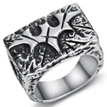 Macro detail of gothic signet ring featuring vintage silver cross relief and oxidized texture - 24408