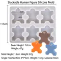 Silicone stacking human mold with orange, brown and blue resin figurines - Stacking Humanoid Silicone Mold