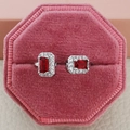 Silver stud earrings with rectangular red gems in a pink velvet jewelry box - Open Adjustable / Red