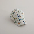 Detail of white kids baseball cap featuring colorful cartoon dinosaur prints and Roar text - 52cm 2-5 Years Old / Small Dinosaur