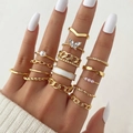Bohemian gold 14-piece ring set with butterfly and pearl accents on hand model - Adjustable Open / YY-12292 (14-Piece Set) / Gold