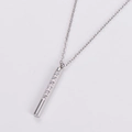 Detailed view of silver polished bar necklace with sparkling zircon pavé on O-chain - Steel
