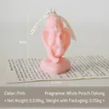 Pink cherub angel scented candle on a heart base with a decorative ribbon bow - Pink (White Peach Oolong)