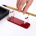 Red acrylic display stand for fountain pens and brushes with stable rectangular base - Red
