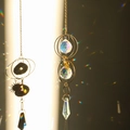 Golden suncatcher crystal ball wind chime casting rainbow light spots on wall - Design No.10
