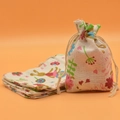 Linen drawstring pouch with printed cartoon pattern and lettering on orange background - Rabbit