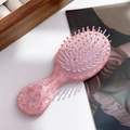 Roze marmerpatroon acetaat haarkam met massageborstels in een handig klein formaat - Metaalroze