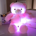 Pink glowing plush puppy toy with soft material and a white decorative ribbon tie - Pink Bear