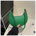 Detail of green crescent hobo bag featuring smooth faux leather and gold metal hardware - Green