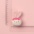 Handmade crochet white rabbit head keychain with pink bow and precise 5cm size scale - Pink Dumpling Rabbit Doll