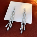Detail view of long silver tassel earrings with tiered baguette-cut cubic zirconia crystals - 22# Silver Stepped Tassel Style (ai-Style22)