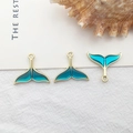 Three pieces of golden alloy whale tail pendants with blue enamel for DIY jewelry making - 1pc Gold Mermaid Tail