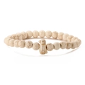 Detailed view of white turquoise beads and penguin pendant on this beaded stretch bracelet - Beige White Turquoise