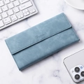 Slim matte foggy blue wallet with Besines logo shown on a minimalist marble desk - Matte Light Blue