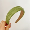 Green faux leather headband with wide pleats and glossy finish for stylish women - Green