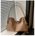 Detail of khaki leather tote with embossed letters and drawstring knot texture - Khaki